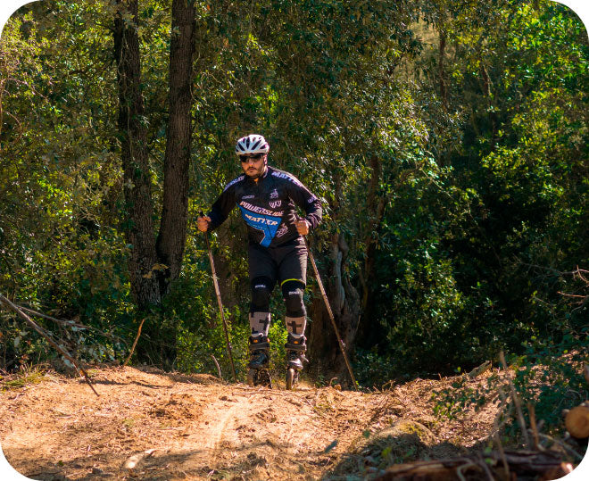 A man holding poles and wearing Powerslide Nordic inline skates