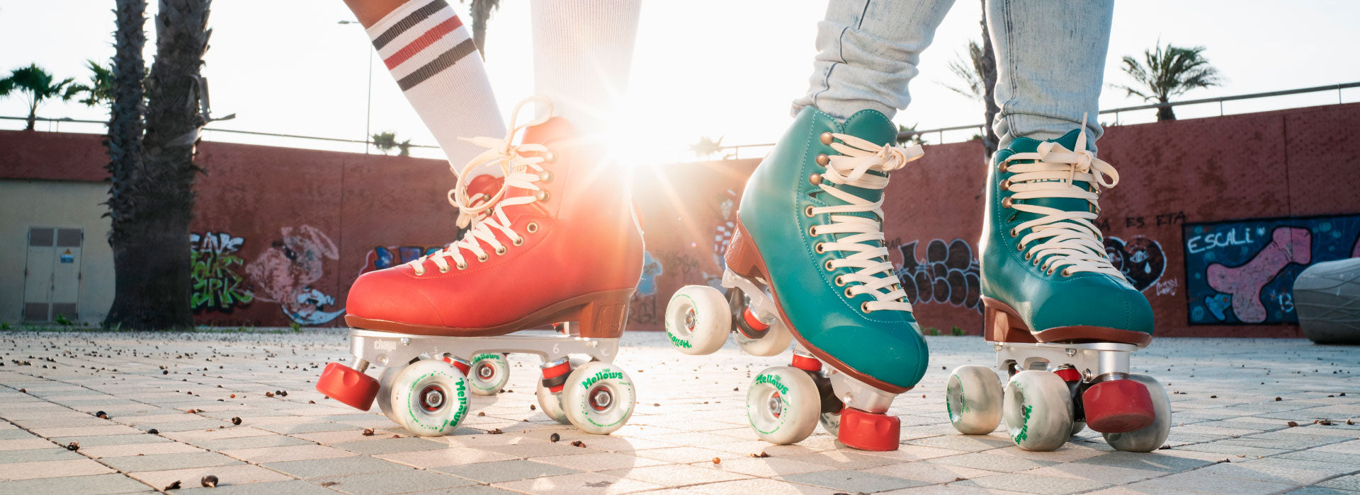 A female with long brown hair dances one roller skates and holds up one leg