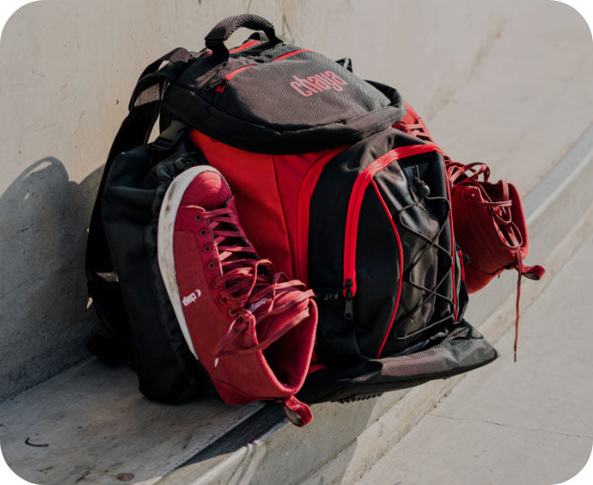 A close-up image of a pair of roller skates connected to a backpack